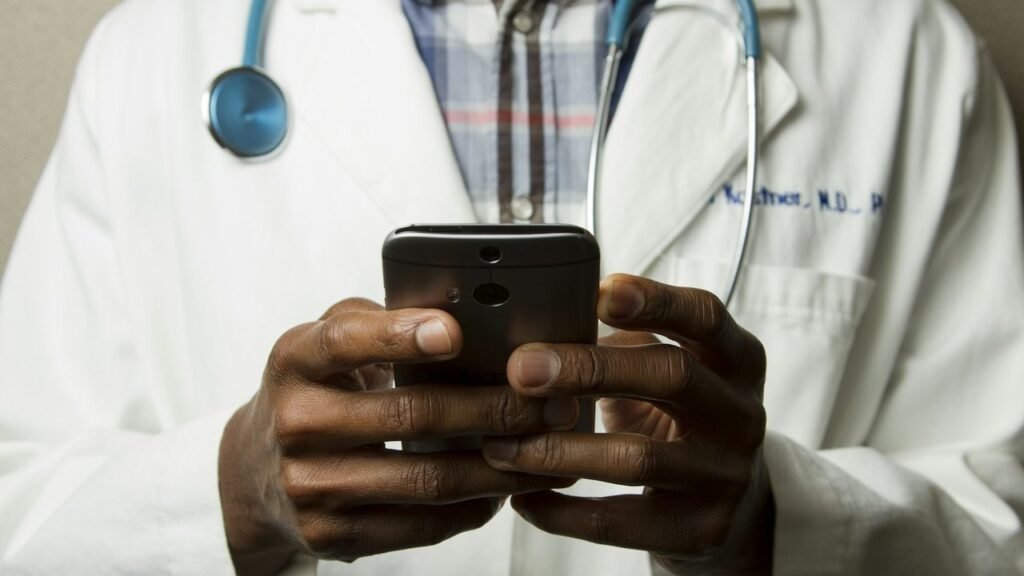 Healthcare professionals reviewing information at a workstation