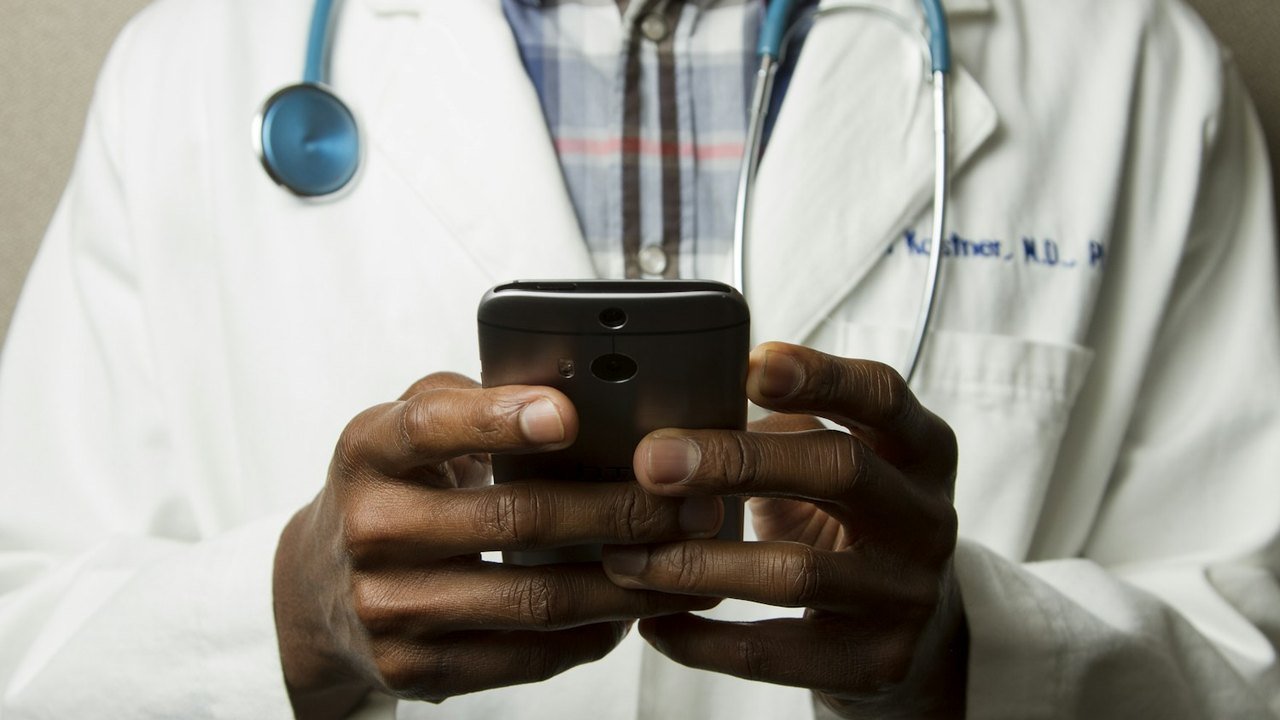 Healthcare professionals reviewing information at a workstation