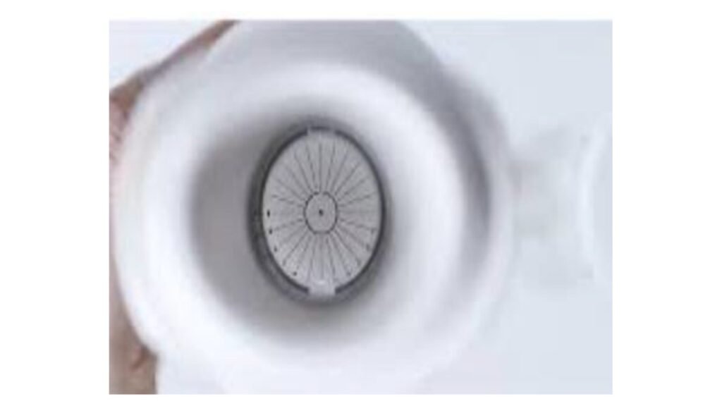 Internal fixation target as seen through the eyepiece of ClickCheck™, demonstrating the high-contrast radial pattern used for clarity judgment [22].